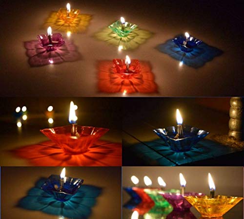 Close-up of multicolour flower-shaped diyas creating 3D reflection