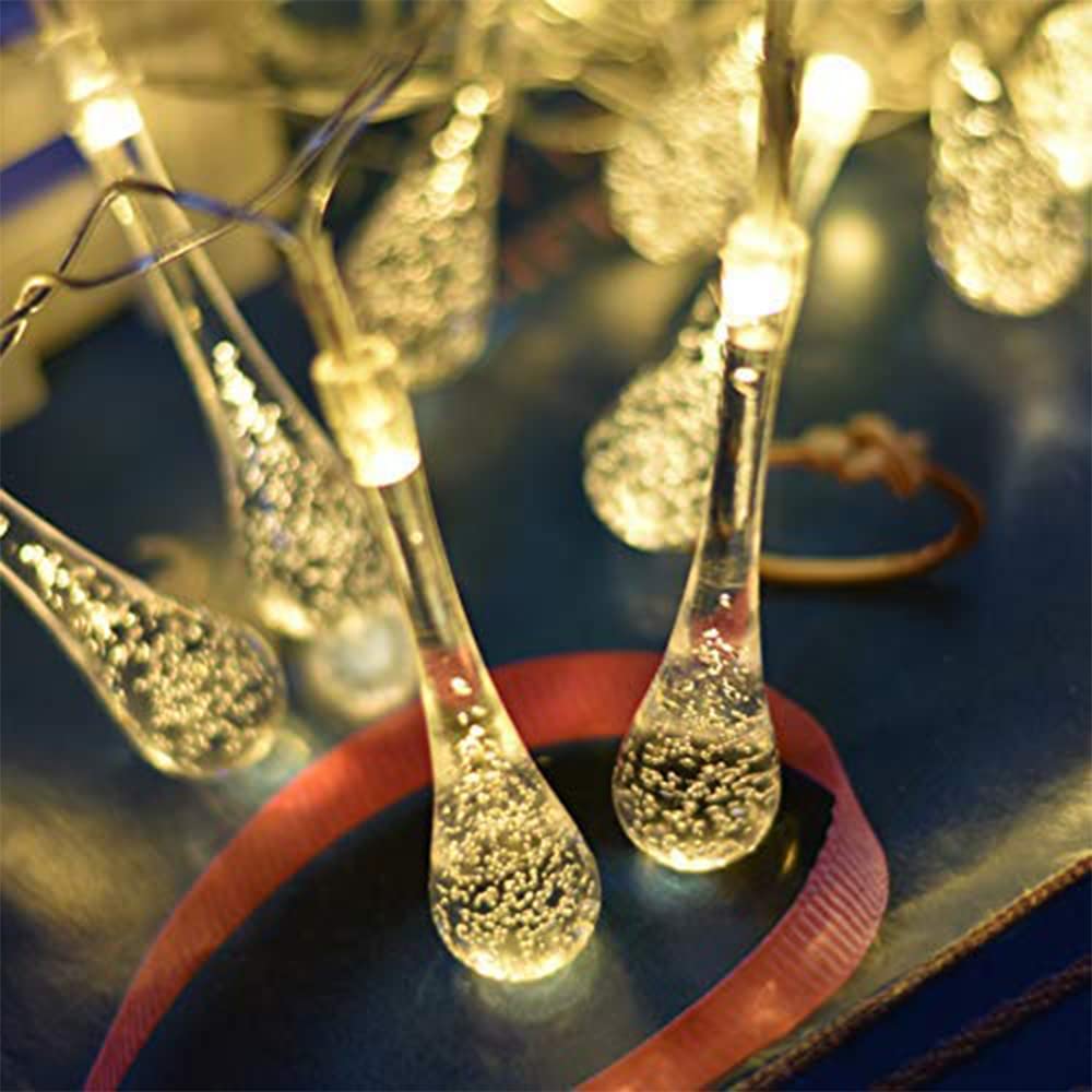 Close-up of water drop-shaped LED bulbs on DECAWALL string lights