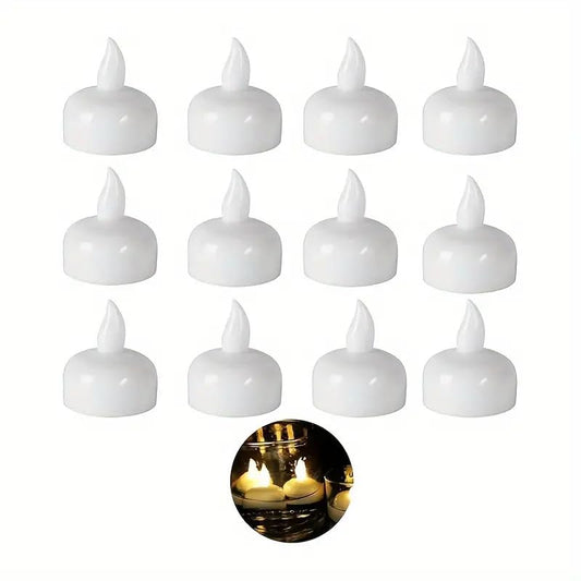 Floating LED tealights glowing in warm yellow in a decorative bowl