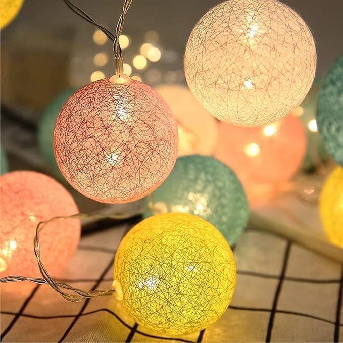  Multi-color string lights decorating a garden space