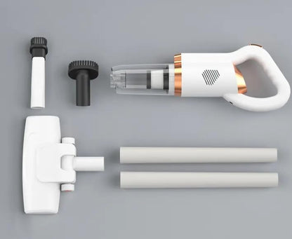 Vacuum cleaner in use on office desk or car interior