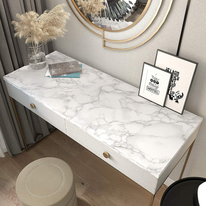White marble wallpaper used as a shelf liner in a kitchen cabinet