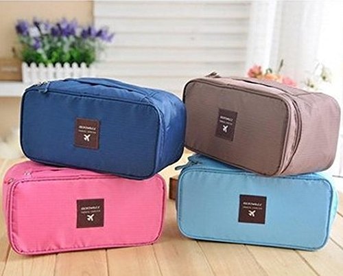 Women using Decawall travel pouch case to organize underwear and accessories in a suitcase