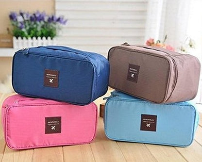 Women using Decawall travel pouch case to organize underwear and accessories in a suitcase